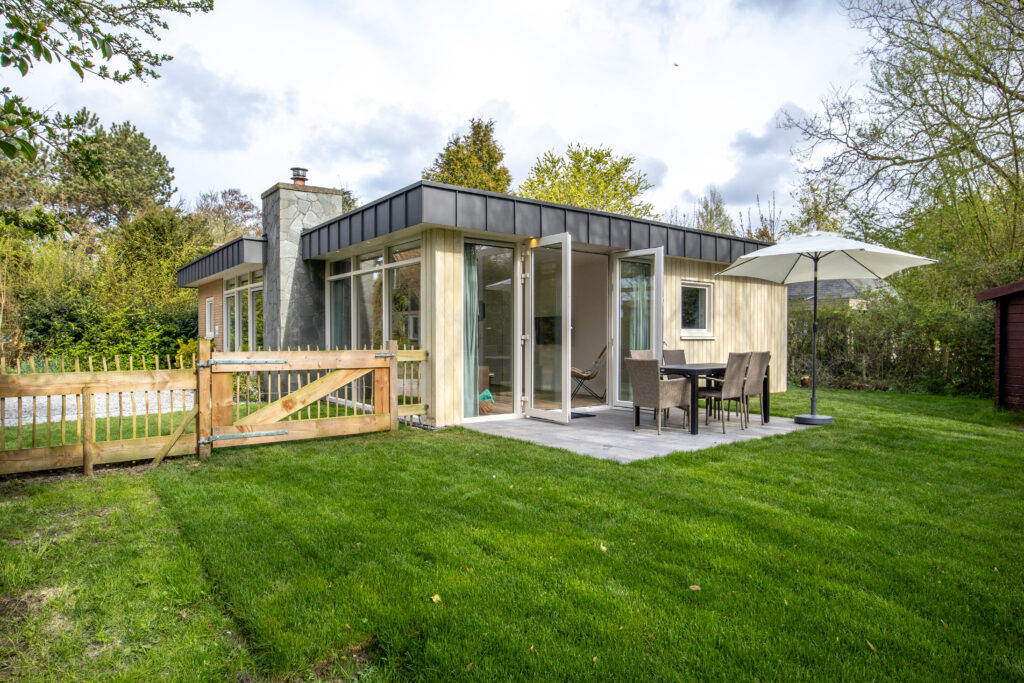 House extension on a midcentury holiday house with a chimney, De Cocksdorp, Texel, Netherlands